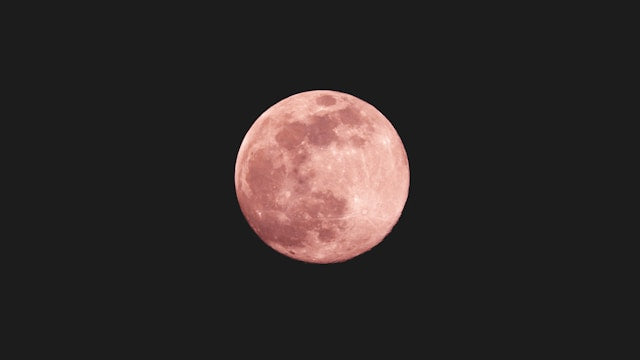 Pink full moon in April night sky symbolizing renewal and emotional clarity